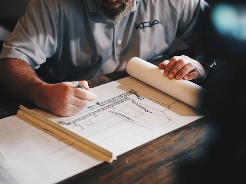 Carpenter working on timber framing in a residential home